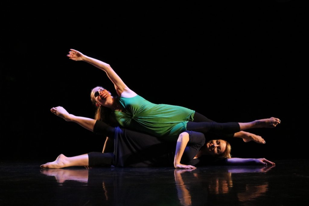 Several dancers in horizontal positions