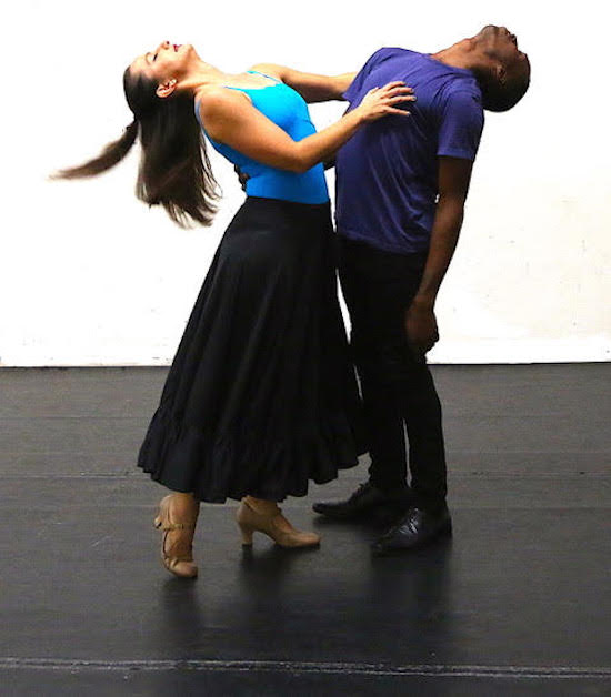 Two dancer bend backwards