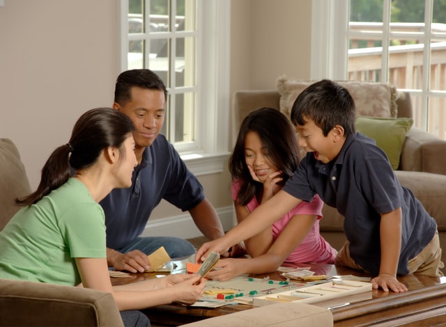 Family Playing Monopoly Photo by National Cancer Institute on Unsplash