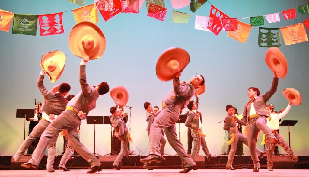 Mexican folkloric dancers with large hats perform