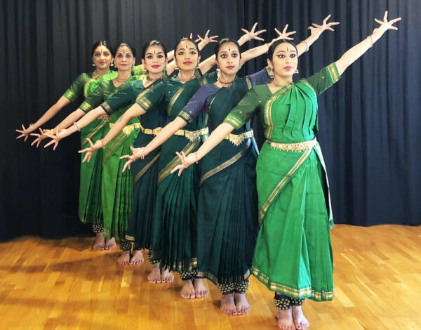 South Asian dancers in green