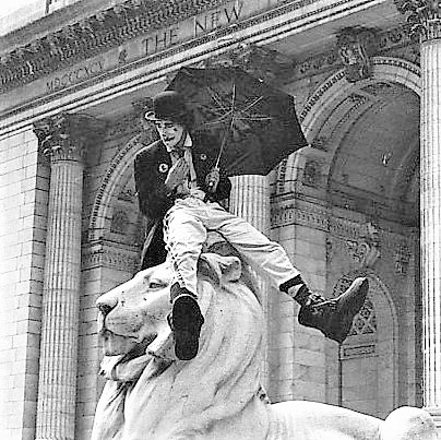 Gino Cumeezi atop the Lion at NYC's 42nd St. Public Library
