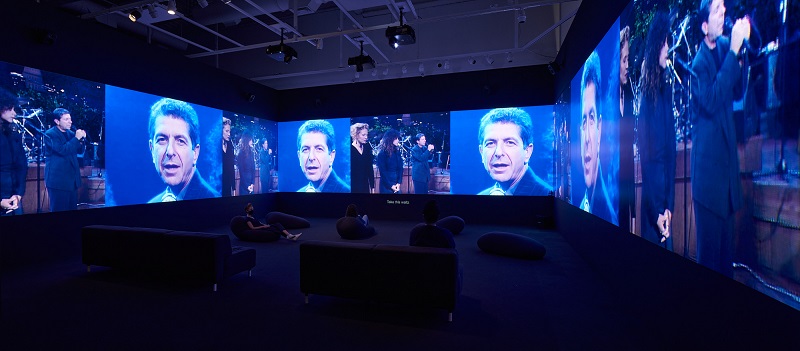 George Fok's "Passing Through" video features multiple screens featuring Leonard Cohen.