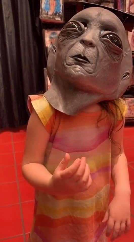child in alien mask