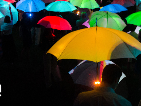 Lots of umbrellas lit in different colors