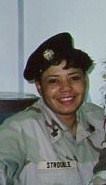 A young Black woman, Athena Lark, in her military uniform