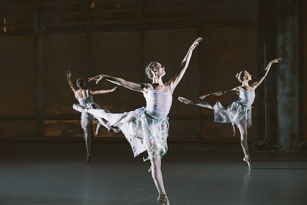 Three dancers in arabesque