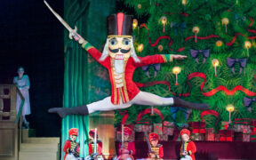 A Nutcracker leaps in front of soldiers