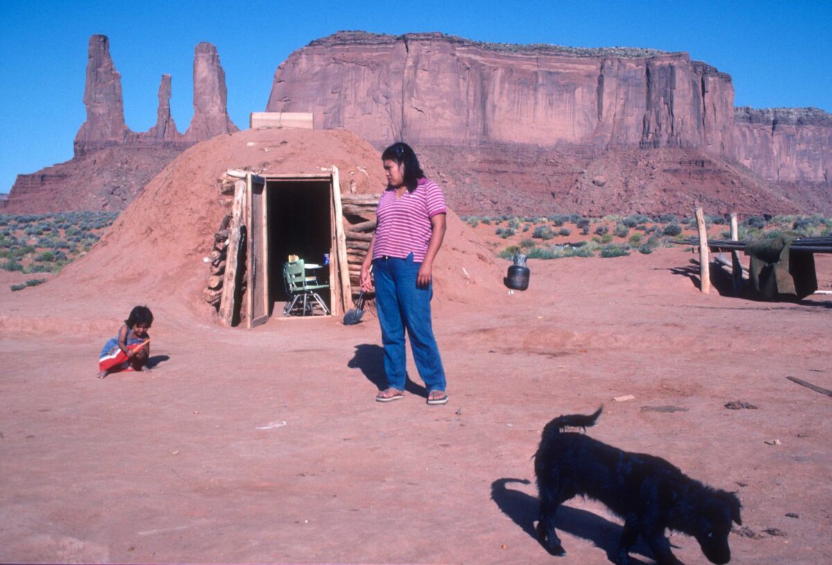 Navajo family living in hogan, mud hut. Monument Valley