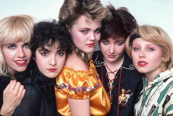 Five members of the band Go Gos face the camera