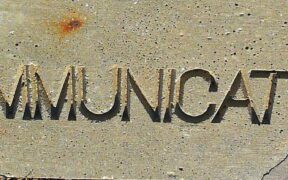 a plaque that reads COMMUNICATION