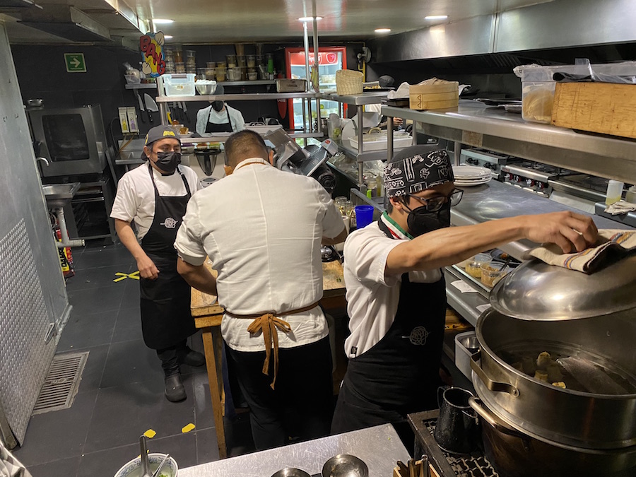 Chefs at work in the upper kitchen of Nudo Negro