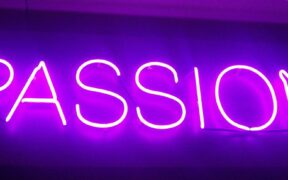 the word Passion in purple neon