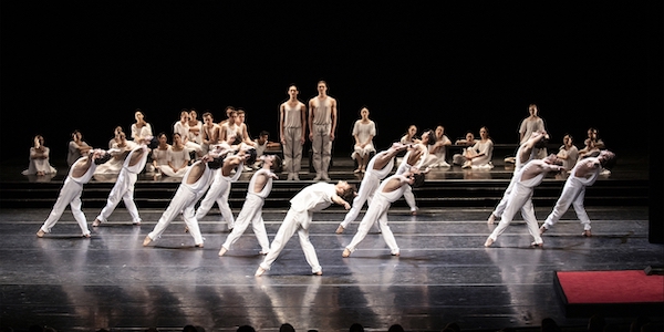 A large group of dancers in white in Hamburg Ballet's 