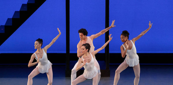 A male and three female dancers in white
