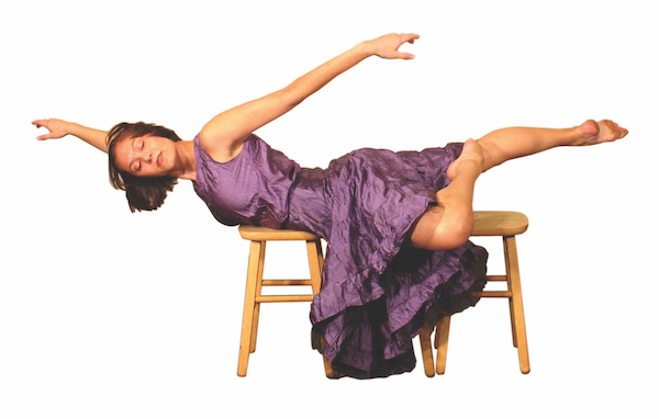 Dancer in a purple dress poses on two stools