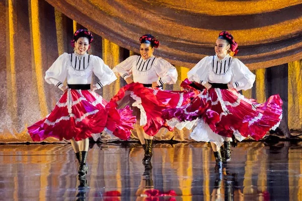 three women dancing folklorico