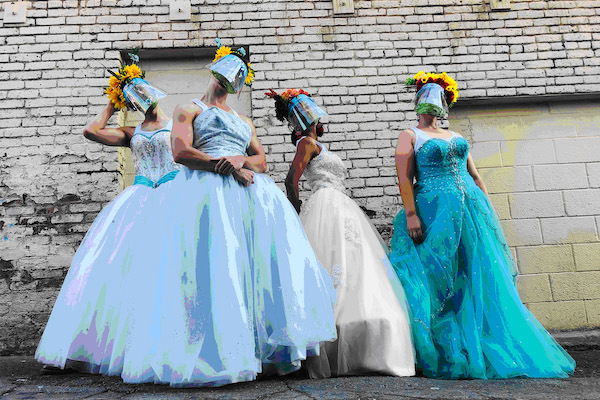 Four masked figures in long fancy dresses