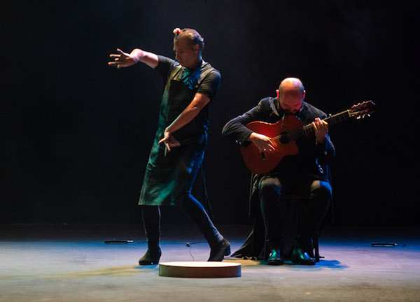A flamenco dancer and a guitarist
