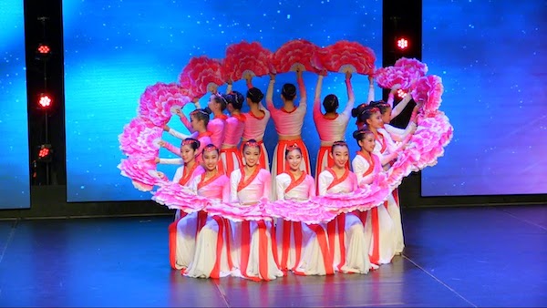 dancers with a circle of fans