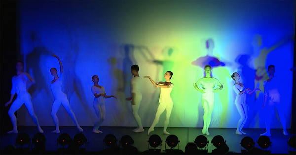 Dancers in blue and green light