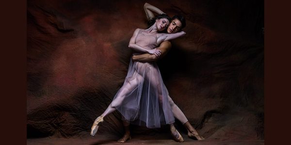 Two dancers in amorous pose