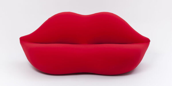 View of a red sofa in the shape of lips