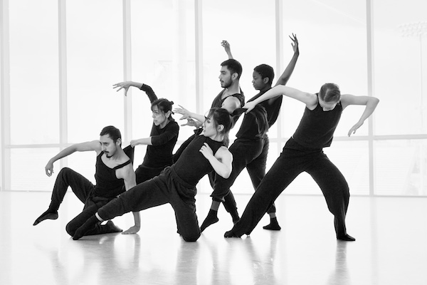 A group of dancers lunge