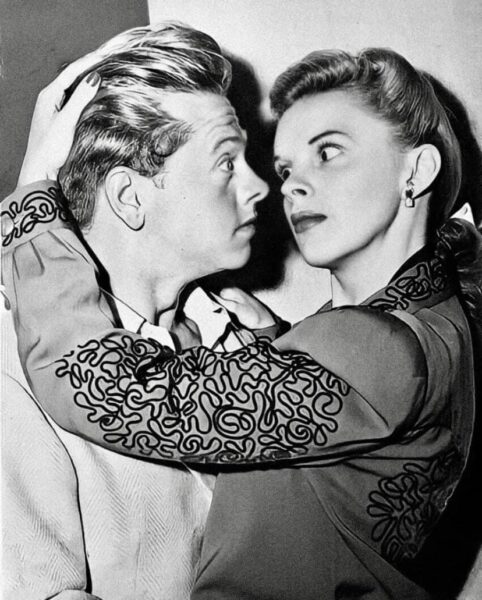 a black white photo of Mickey Rooney and Judy Garland
