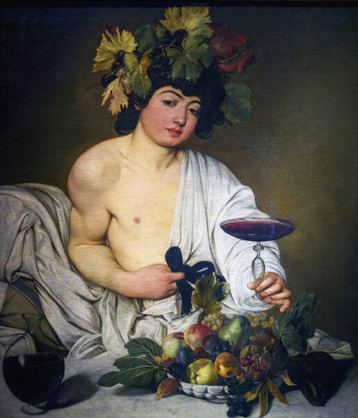 Boy holding glass of wine
