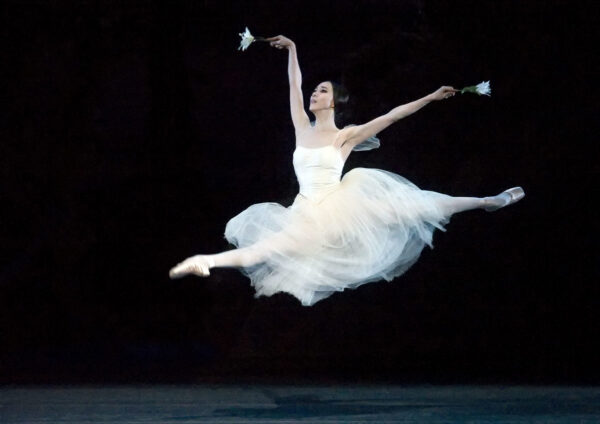 A ballet dancer in white costume